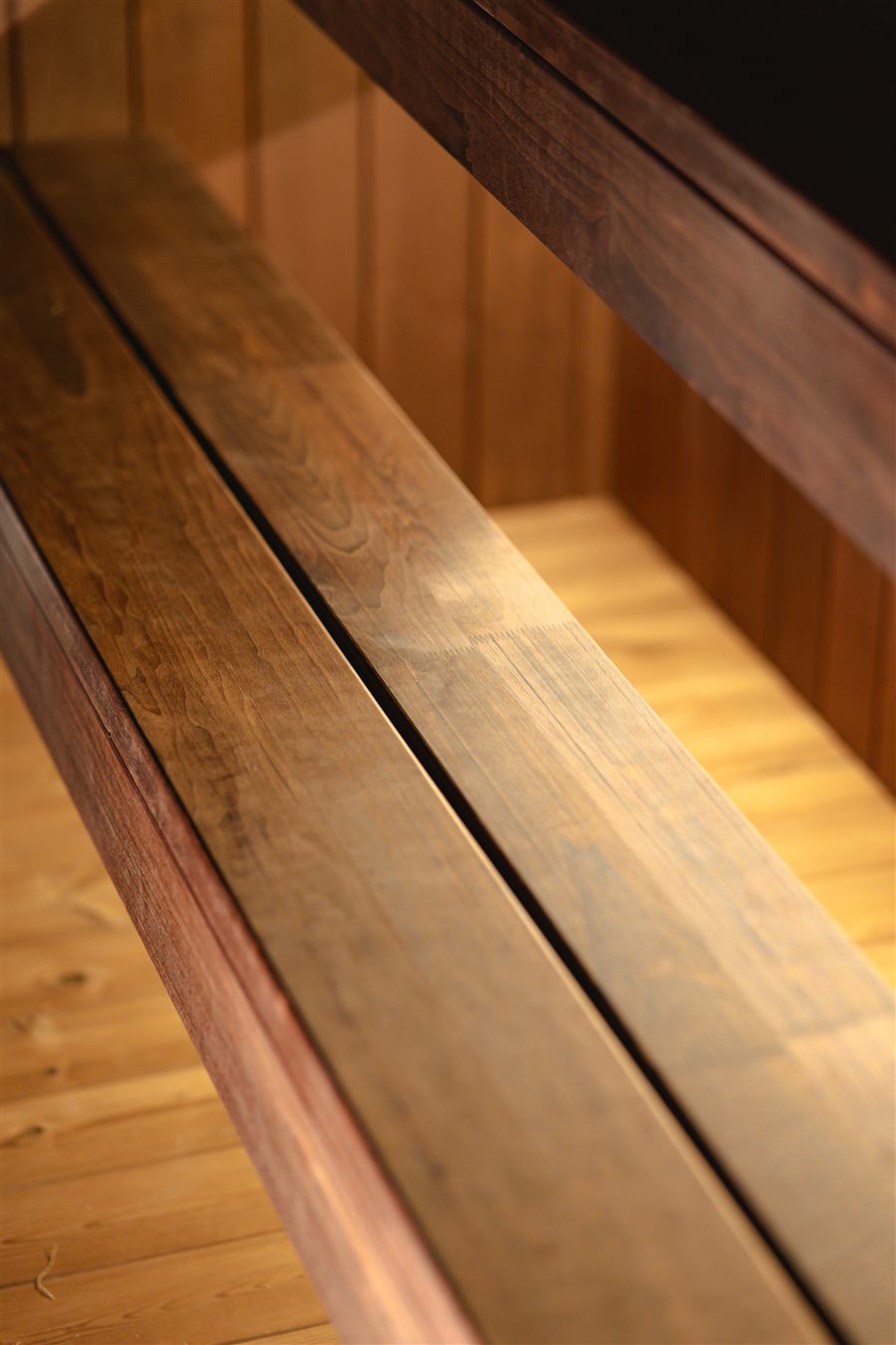 Base interior with solid aspen benches against the panel face